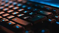 Black keyboard with blue letters