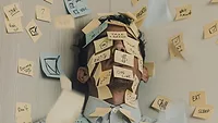 Man covered in notes
