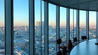 Curved office wall of floor to ceiling windows Curved office wall of floor to ceiling windows