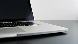 Open laptop on dark gray desk