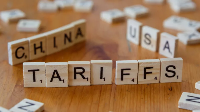 Tariffs in block letters with China and USA behind