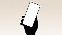 Silhouette of hand holding phone