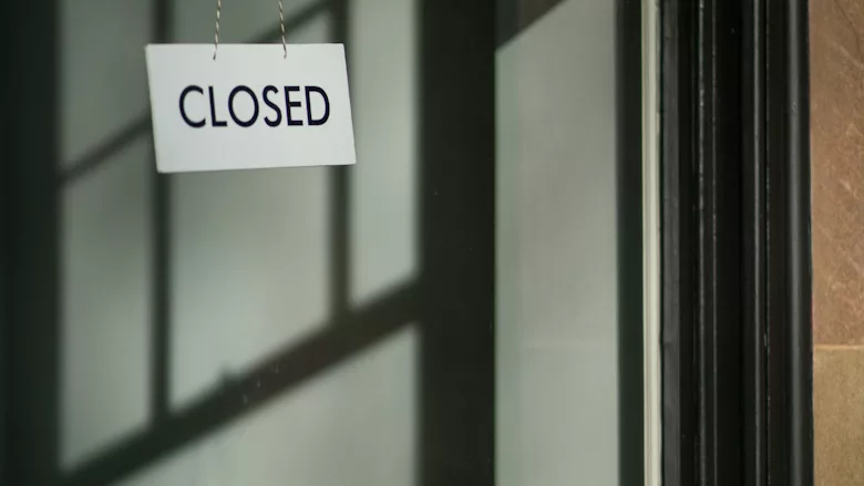 Shop window with white 'closed' sign