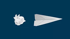 Crumpled paper and paper airplane