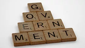 Scrabble tiles spelling out 'Government'