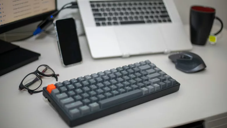Keyboard with laptop and monitor 