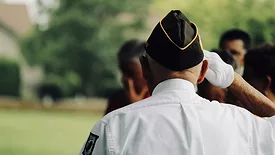 Man in uniform saluting