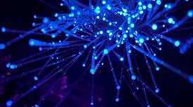 Threads of bright blue light on dark background