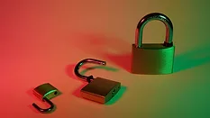 Two open padlocks with one closed