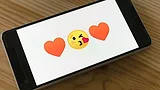 Phone showing hearts and flirty emojis