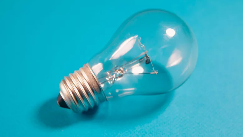 Lightbulb on blue background
