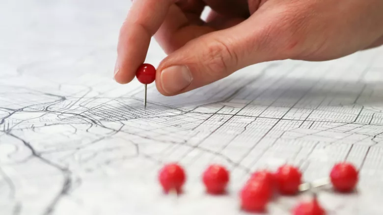 Person placing location pin on map 