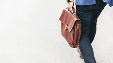 Man walking with briefcase Man walking with briefcase