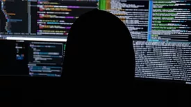 Head in front of monitors 