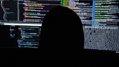 Head in front of monitors 