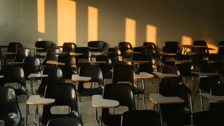 Student desks in a room 