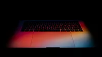 Laptop keyboard in gradient colorful light