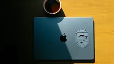 Laptop and coffee in shade 