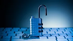 Opened padlock on computer keyboard 