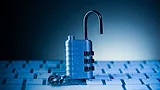 Opened padlock on computer keyboard 