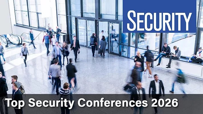 Image of people walking in hallway with text reading "Security Top Conferences of 2026"