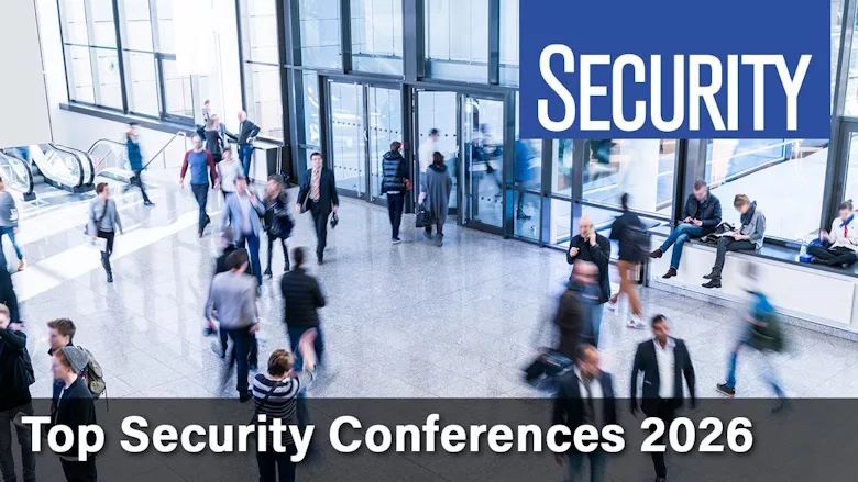 Image of people walking in hallway with text reading "Security Top Conferences of 2026"