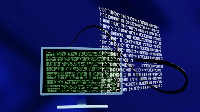 Computer with binary code hovering nearby