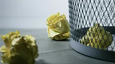 Crumpled paper and trash bin Crumpled paper and trash bin