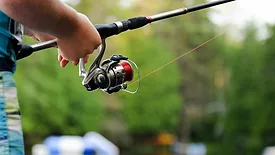 Person holding fishing pole