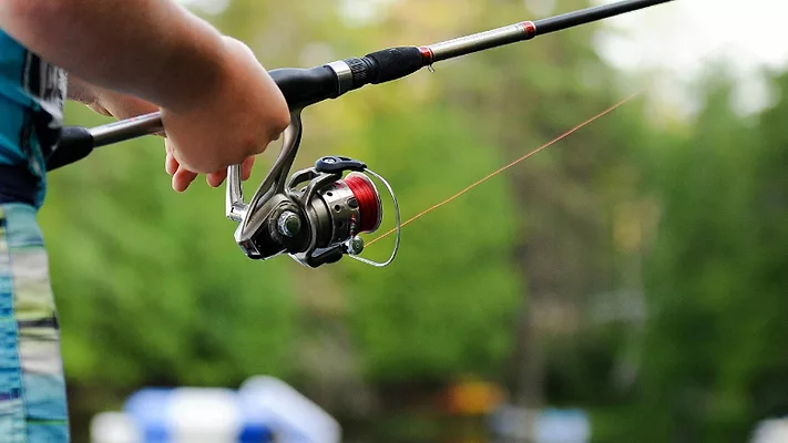 Person holding fishing pole