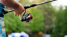 Person holding fishing pole