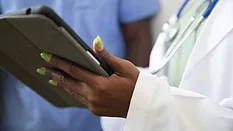 Medical worker holding tablet