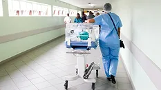 Healthcare professional with incubator 