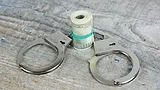 Handcuffs and cash Handcuffs and cash