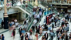Blurry photo of people moving through the mall