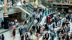 Blurry photo of people moving through the mall