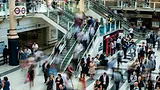 Blurry photo of people moving through the mall