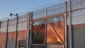 security fence with barbed wire