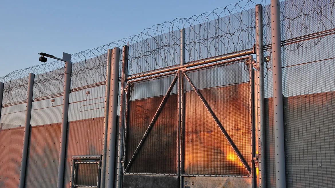 security fence with barbed wire