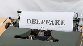 Page in typewriter that reads "deepfake"