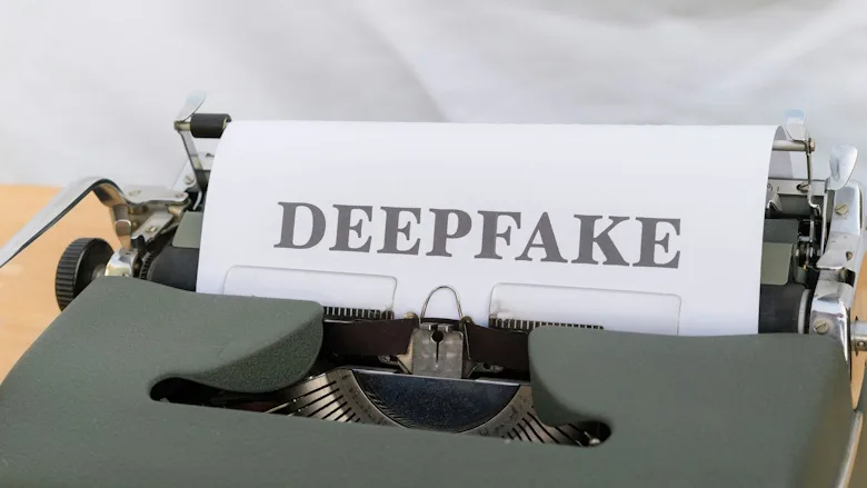 Page in typewriter that reads "deepfake"