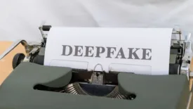 Page in typewriter that reads "deepfake"