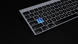 Laptop keyboard with "AI" button illuminated