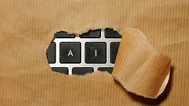 Keyboard covered in kraft paper with the letters "ai" exposed