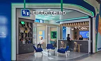 People talking at a Fifth Third bank counter People talking at a Fifth Third bank counter