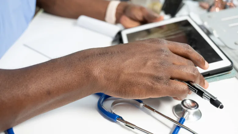 Medical professional using tablet
