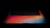 Laptop keyboard in gradient colorful light