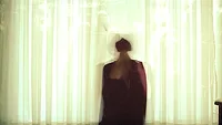 Blurry person behind curtain Blurry person behind curtain