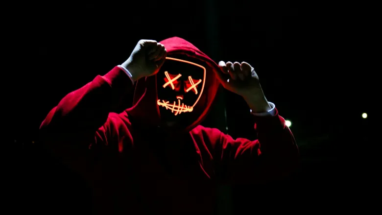 Man in glowing mask