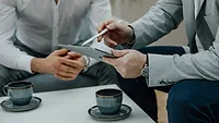Two men working on a tablet